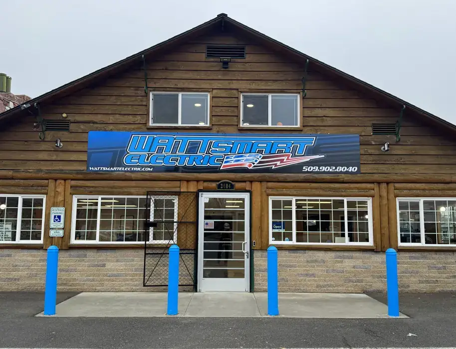 The Wattsmart Electric shop on Fruitvale Blvd in Yakima, a log-sided building with the company banner over the door